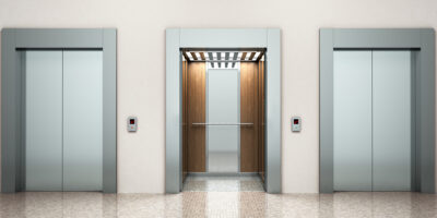 bank of elevators - How To Budget for Elevator Cab Interior Renovations theelevatedcab.com